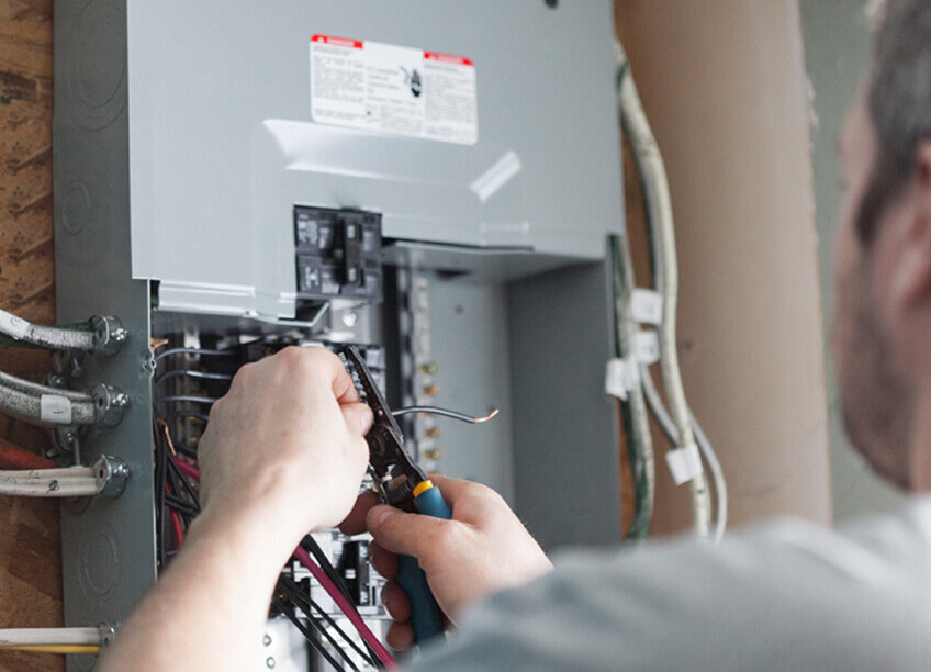 An image showing a circuit breaker box with labeled switches, representing home electrical services, including breaker box installations, circuit panel repairs, lighting installation, furnace replacement, AC repair, ductwork services, HVAC maintenance, and aeroseal duct sealing solutions. This image is ideal for showcasing services related to electrical systems, heating and cooling, HVAC repairs, and energy-efficient solutions.