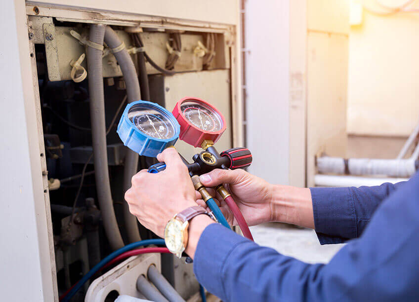 An HVAC technician is performing an emergency AC repair service, ensuring that the air conditioning unit is fixed promptly to restore comfort in the home. With expertise in both heating and cooling systems, the technician works on the AC units, possibly integrating aeroseal duct sealing to improve airflow efficiency. These professionals also handle air quality testing to ensure a healthy indoor environment. The role of HVAC electricians is also crucial for electrical troubleshooting during emergency AC repair services, guaranteeing the unit functions correctly for long-term reliability and energy savings.