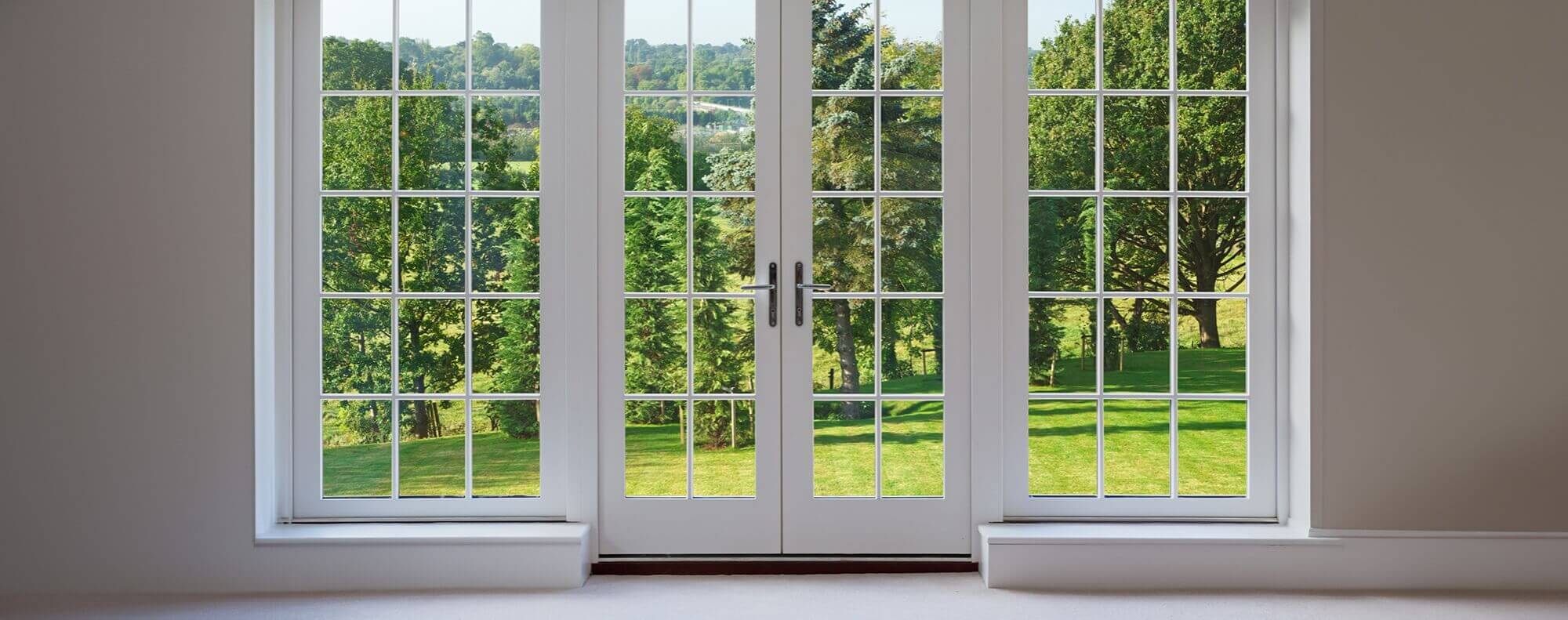 A view of a stylish double window and door combination, emphasizing window and door installation and repair services as part of home maintenance. This image highlights the connection between handyman services, such as window and door repairs, and HVAC services like furnace replacement, HVAC installation, and air duct cleaning. Properly installed and maintained windows and doors not only enhance a home's curb appeal but also contribute to energy efficiency and comfort, complementing HVAC solutions for a well-maintained home.